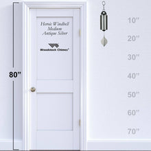 Load image into Gallery viewer, Woodstock Chimes Heroic Windbell Medium in Antique Silver showing size comparison against 80-inch door