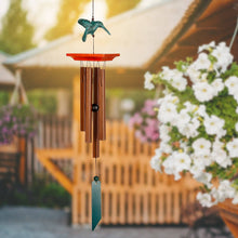 Load image into Gallery viewer, Woodstock wind chime with hummingbird topper and bronze tubes hanging outdoors