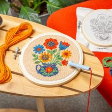 Load image into Gallery viewer, Colorful flower bouquet punch needle embroidery kit with hoop, thread, and pattern on wooden surface
