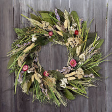Load image into Gallery viewer, Natural dried flower wreath with wheat, lavender, and pink globe amaranth on wooden fence