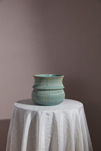 Load image into Gallery viewer, Verdant Pot in glazed teal ceramic with ribbed texture, displayed on a white draped table.