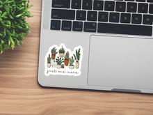 Load image into Gallery viewer, White sticker with illustrated potted plants and 'just one more' text on laptop trackpad