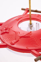 Load image into Gallery viewer, Red hummingbird feeder with fish design and wooden perches showing clear nectar reservoir