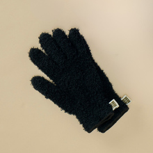 Load image into Gallery viewer, Black fuzzy textured gardening gloves with white label tags on cream background