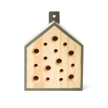 Load image into Gallery viewer, Wooden bee house with multiple drilled holes and grey trim for garden pollinators