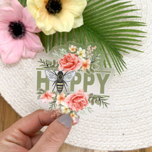 Load image into Gallery viewer, Clear vinyl sticker with bee illustration and HAPPY text surrounded by pink roses and floral design