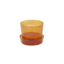 Load image into Gallery viewer, Amber transparent glass plant pot with matching shallow saucer, warm orange tones