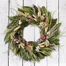 Load image into Gallery viewer, Handcrafted prairie wreath with dried grasses, wildflowers and natural botanicals on white wood background