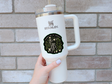 Load image into Gallery viewer, White Stanley mug with green Plants Are My Therapy sticker featuring skeleton watering plants