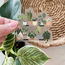 Load image into Gallery viewer, Clear vinyl sticker featuring illustrated houseplants on two-tier shelf with colorful pots