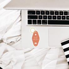 Load image into Gallery viewer, Coral pink motel keychain sticker with white flower and 'plants are my happy place' text on laptop