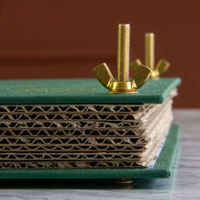 Load image into Gallery viewer, Green linen botanical flower press with gold hardware and corrugated cardboard layers stacked