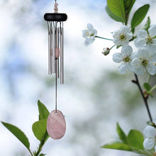Load image into Gallery viewer, Wind chime with silver tubes and rose quartz stones hanging among white cherry blossoms