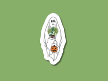 Load image into Gallery viewer, White ghost sticker holding houseplant and Halloween pumpkin basket on green background