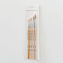 Load image into Gallery viewer, Set of five watercolor paintbrushes with wooden handles and pointed tips in clear packaging