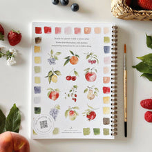 Load image into Gallery viewer, Spiral-bound watercolor fruit painting workbook with color swatches and botanical illustrations surrounded by fresh berries