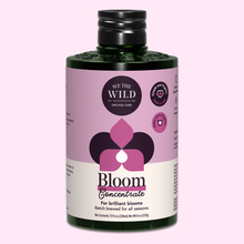 Load image into Gallery viewer, We The Wild Bloom Concentrate orchid fertilizer bottle with purple floral packaging design