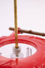 Load image into Gallery viewer, Red hummingbird feeder with wooden perch and clear feeding port close-up view