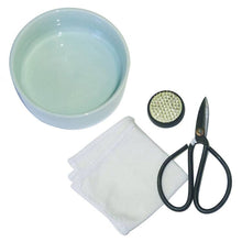 Load image into Gallery viewer, Mini ikebana kit with light blue ceramic bowl, flower frog, scissors and white fabric squares