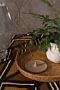 Load image into Gallery viewer, Wooden circular incense holder with central well on rustic wooden surface with plant