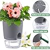 Load image into Gallery viewer, Gray self-watering planter with pink flowers showing water reservoir and drainage system components