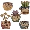 Load image into Gallery viewer, Set of five decorative ceramic succulent pots with carved folk art animal designs in earth tones