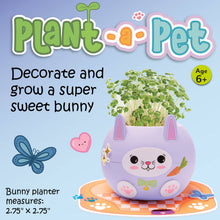Load image into Gallery viewer, Purple bunny-shaped planter with green sprouts growing from top, decorated with stickers and accessories