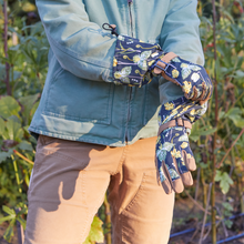 Load image into Gallery viewer, Extended arm gardening gloves with floral pattern being worn while gardening outdoors