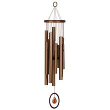 Load image into Gallery viewer, Bronze wind chimes with multiple tubes hanging from wooden top and amber teardrop accent