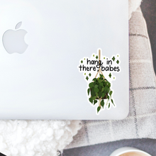 Load image into Gallery viewer, Hang in there babes sticker with hanging plant design on laptop