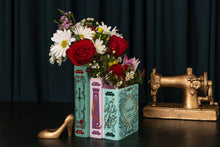 Load image into Gallery viewer, Triple Book Vase designed like stacked Grimm's Fairy Tales books filled with colorful flowers