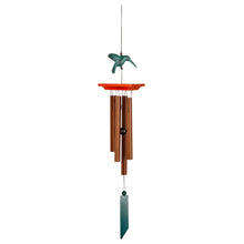 Load image into Gallery viewer, Wooden wind chime with green hummingbird topper and orange platform against white background