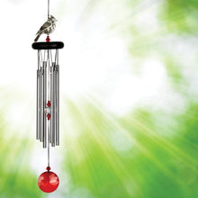 Load image into Gallery viewer, Wind chime with cardinal bird figurine, black tubes, and red crystal ball against green background