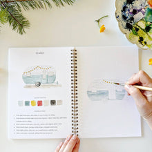 Load image into Gallery viewer, Spiral-bound camping watercolor workbook open to vintage trailer painting tutorial with step-by-step instructions