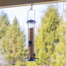 Load image into Gallery viewer, Matte black cylindrical bird feeder with clear tube filled with seeds hanging outdoors