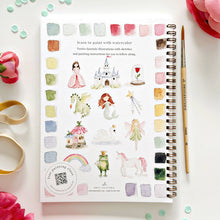 Load image into Gallery viewer, Spiral-bound watercolor painting workbook featuring fairytale illustrations with color palette and paintbrushes