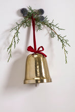 Load image into Gallery viewer, Gold hammered metal Christmas bell with red velvet bow and evergreen branch decoration