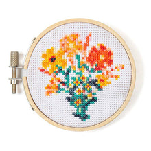 Load image into Gallery viewer, Colorful cross-stitch embroidery of flowers in wooden hoop frame on white fabric