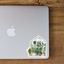 Load image into Gallery viewer, Decorative greenhouse sticker with various potted plants on silver laptop