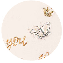 Load image into Gallery viewer, Round white garden stone with gold butterfly, crown charm and cursive 'you' text