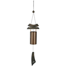 Load image into Gallery viewer, Bronze wind chime with wooden platform and fabric clapper hanging vertically