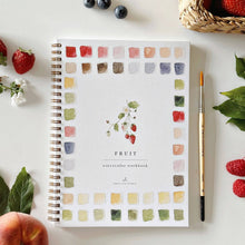 Load image into Gallery viewer, Spiral-bound watercolor workbook with fruit theme showing color palette squares and paintbrush surrounded by fresh berries