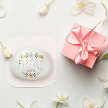 Load image into Gallery viewer, White oval garden stone with 'FRIEND You're the Best' text and pink floral design