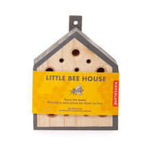 Load image into Gallery viewer, Wooden bee house with multiple holes and yellow packaging label for garden pollinators
