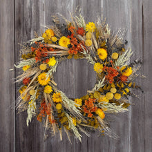 Load image into Gallery viewer, Santa Barbara Harvest Wreath featuring dried yellow strawflowers, orange blooms, wheat, and eucalyptus on rustic wood