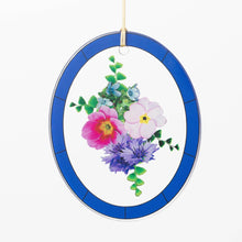 Load image into Gallery viewer, Hanging wind chime with blue border and colorful pressed flower arrangement in center