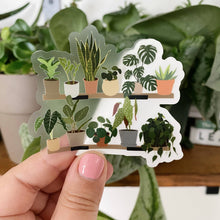 Load image into Gallery viewer, Clear vinyl sticker featuring illustrated houseplants on two-tier shelf with colorful pots