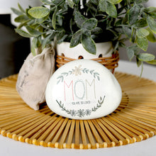 Load image into Gallery viewer, White decorative garden stone with 'MOM You Are So Loved' text and floral wreath design