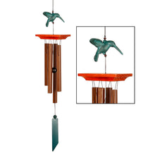 Load image into Gallery viewer, Hummingbird wind chime with green patina bird topper, orange platform, and bamboo tubes