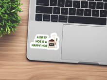 Load image into Gallery viewer, Gardening humor sticker on laptop showing soil bag with text about dirty hoe being happy hoe
